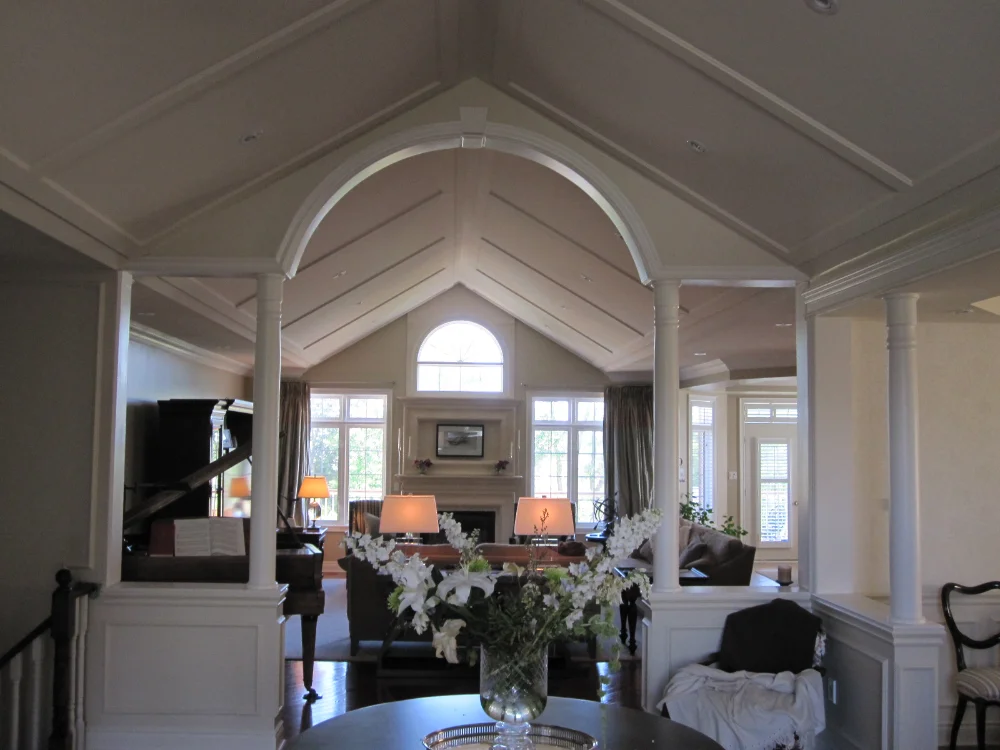 Spacious living room with vaulted ceiling and decor