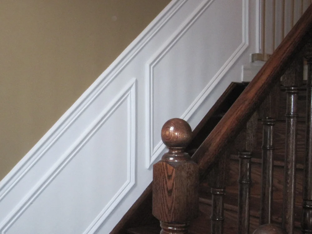 Close-up of wooden staircase with wainscoting